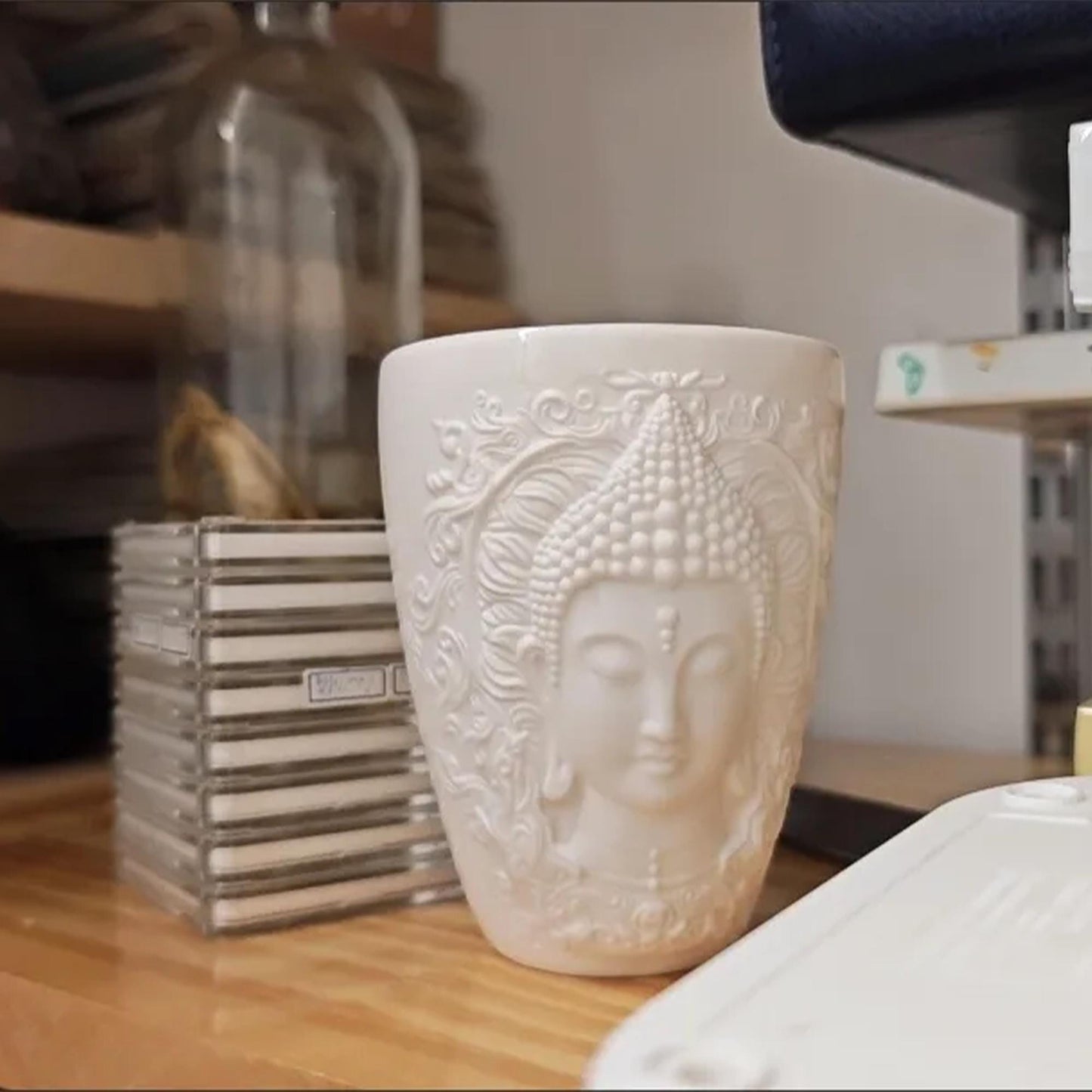 Elegant White Ceramic Buddha Relief Mug